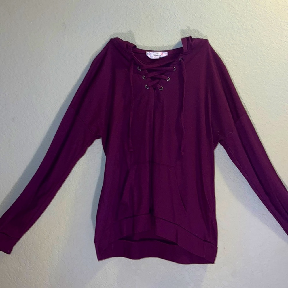 Maroon sweater.